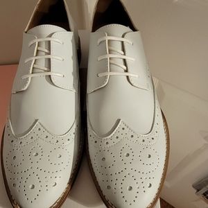 White wingtip shoes